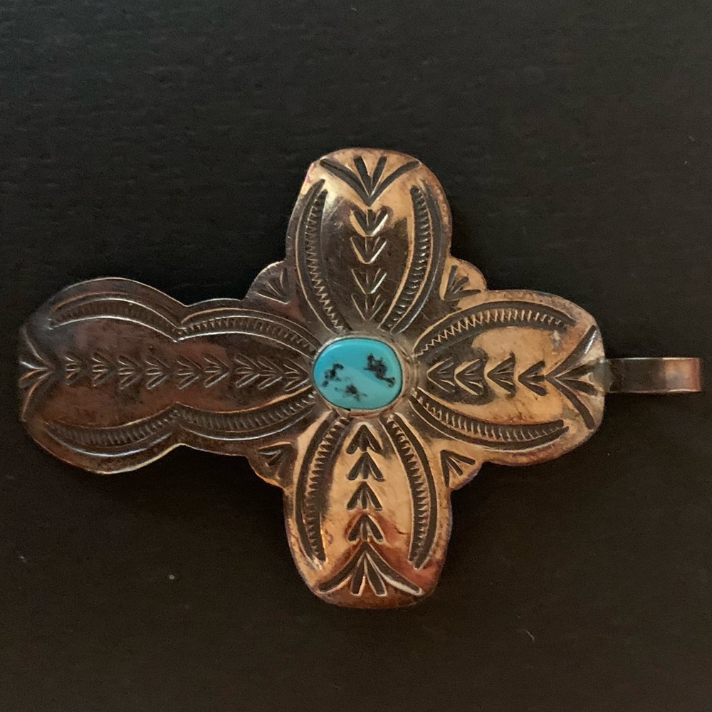 Silver cross pendant with blue stone